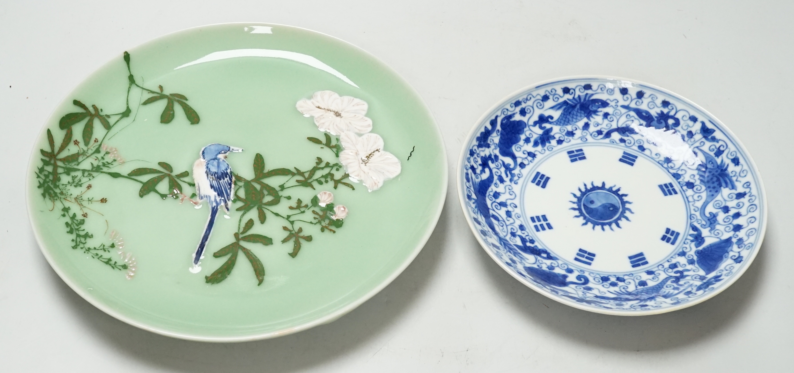 A Japanese celadon ground dish and a Chinese blue and white dish, largest 22cm diameter